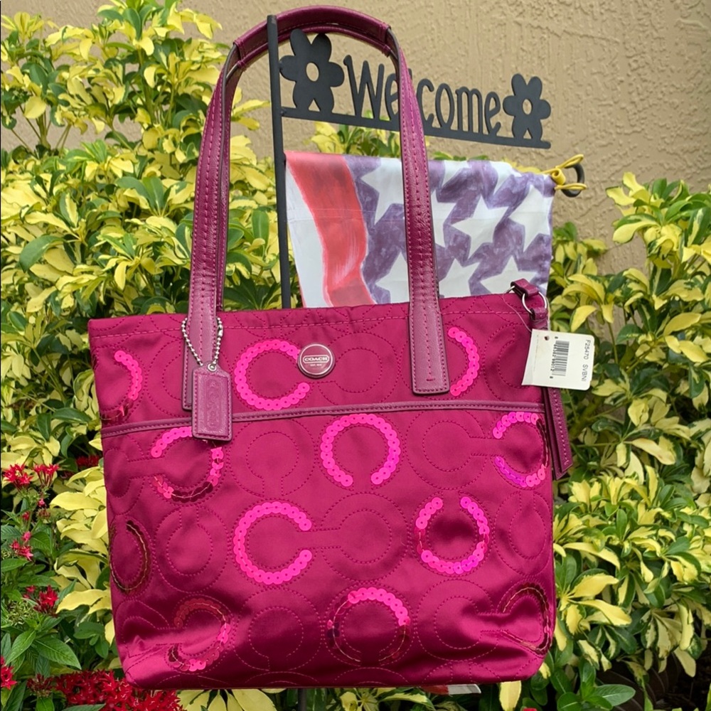 Coach Pink Tote Bag with Glossy Finish and Structured Design